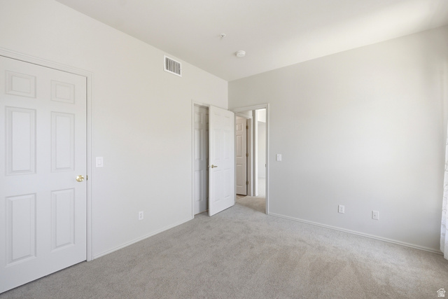 900 Bitner Road, Unit P20 Park City, UT 84098 - Photo 19 of 42 Neutral-toned room featuring light gray carpeting and white painted walls