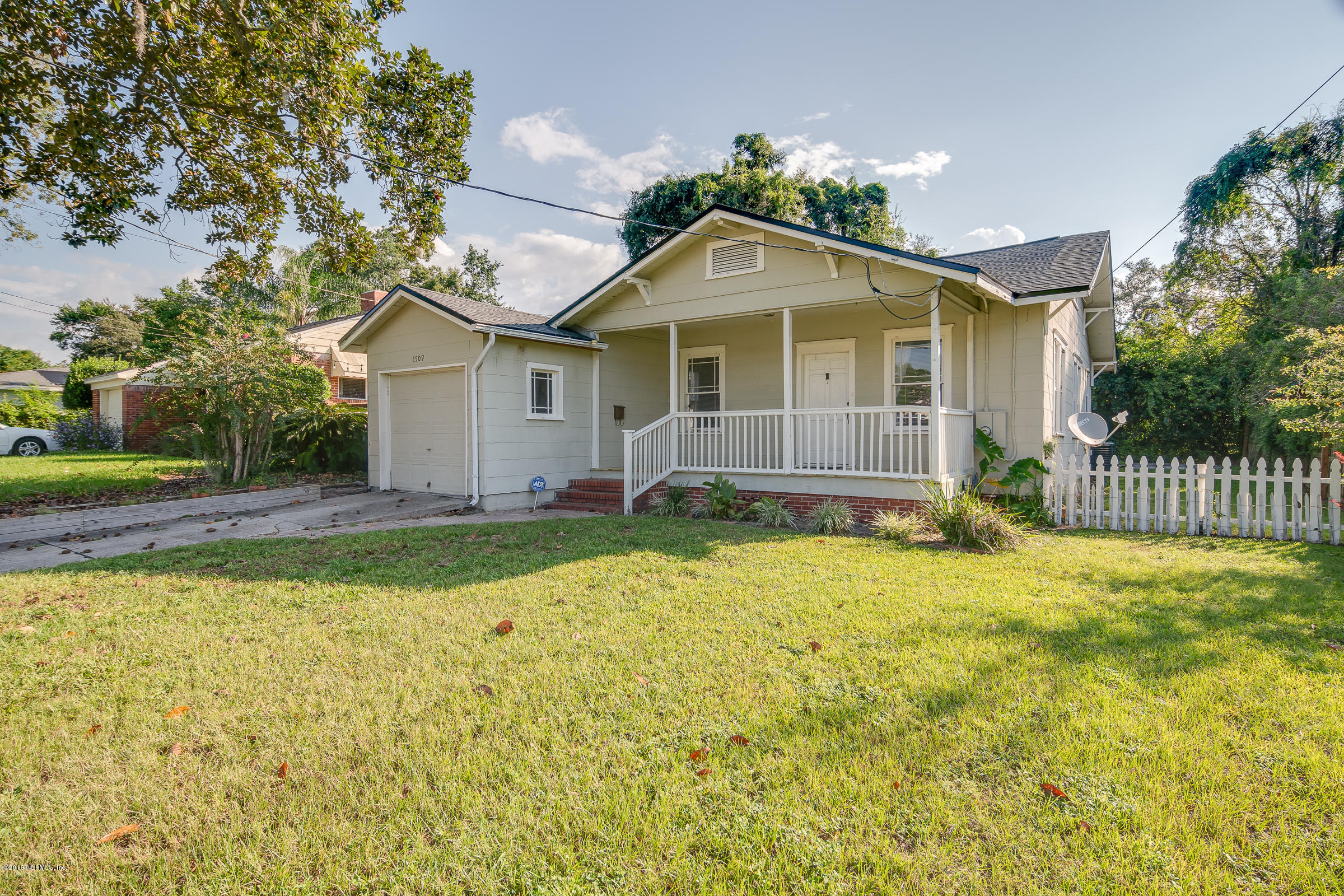1509 Mayfair Road Jacksonville, FL 32207 - Photo 1 of 22 a front view of a house with a yard
