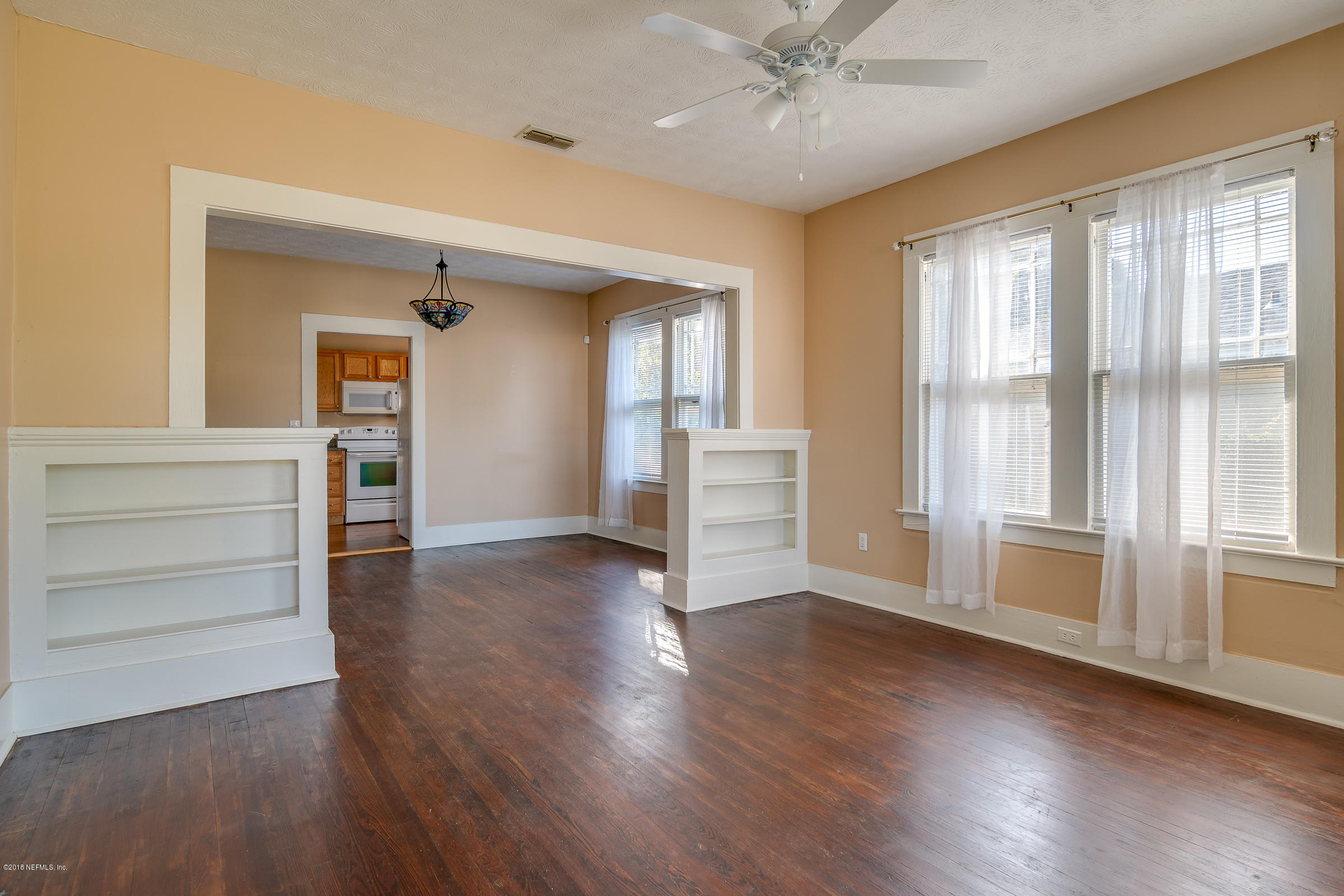 1509 Mayfair Road Jacksonville, FL 32207 - Photo 21 of 22 wooden floor in an empty room with a window