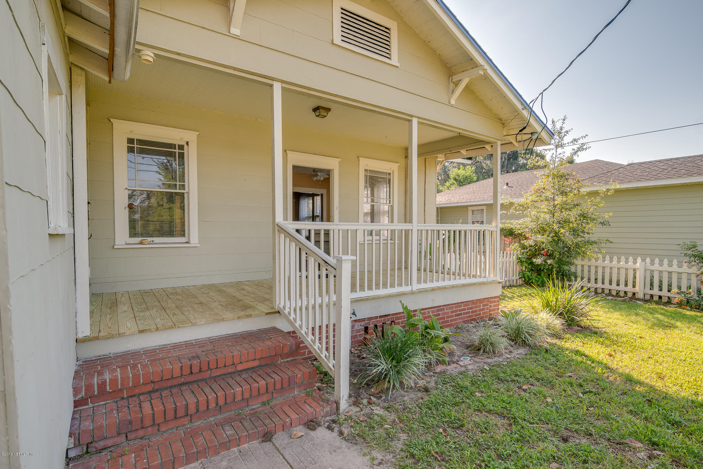 1509 Mayfair Road Jacksonville, FL 32207 - Photo 3 of 22 a view of a house with a small yard and wooden floor and fence