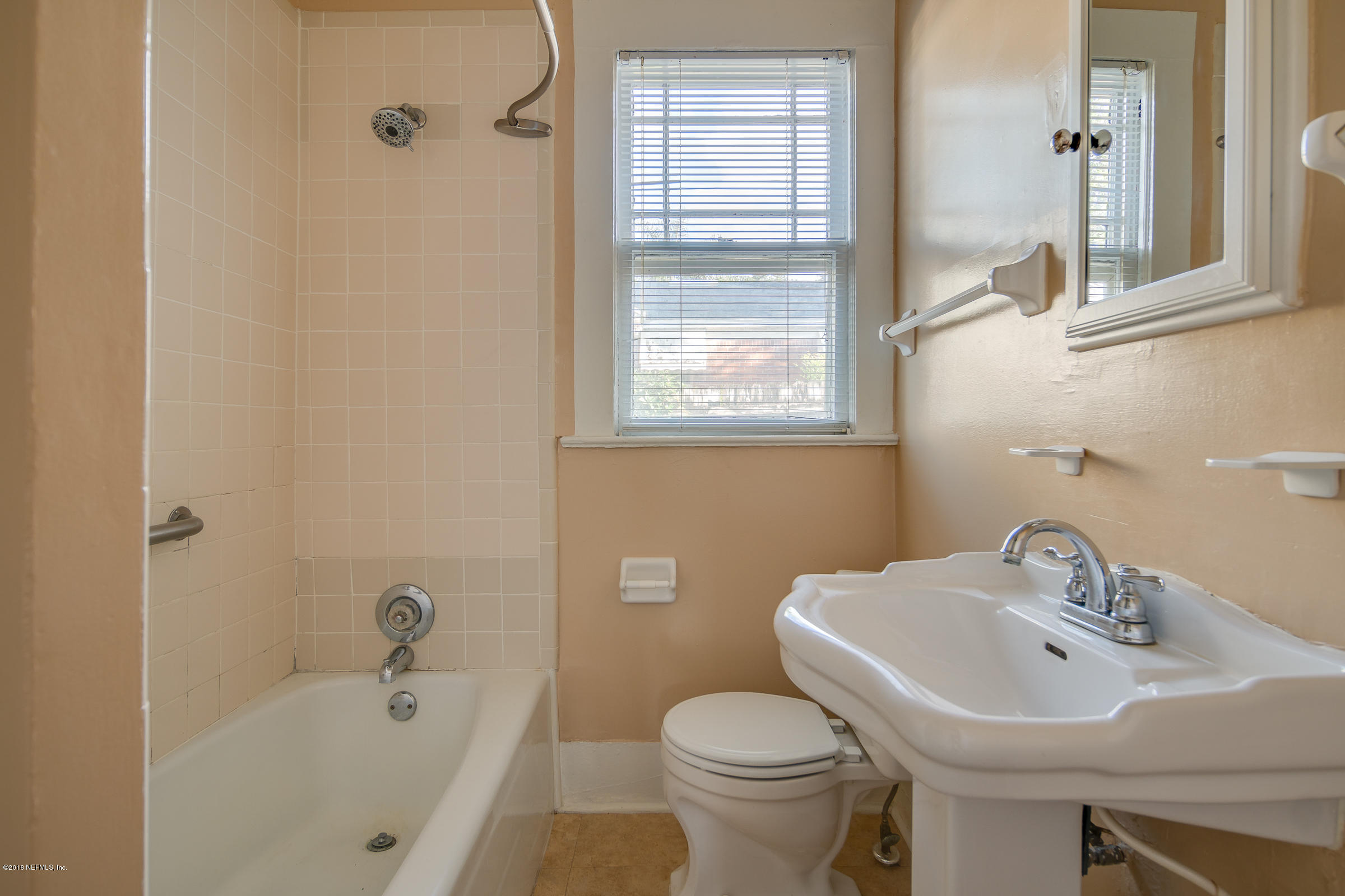 1509 Mayfair Road Jacksonville, FL 32207 - Photo 8 of 22 a bathroom with a sink toilet and shower