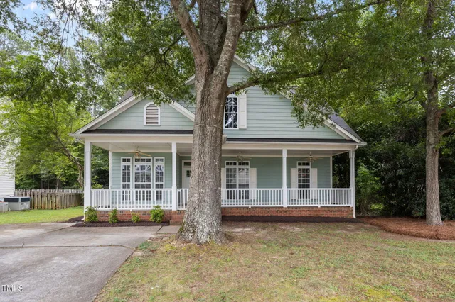 front view of a house with a garden