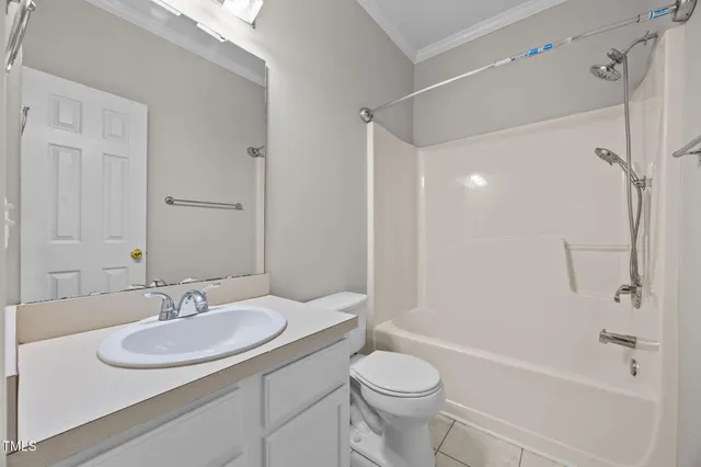 a bathroom with a sink toilet tub and shower