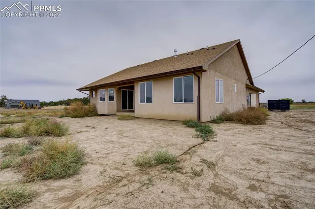 a grey house with yard
