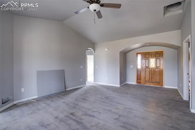 a view of an empty room with a window