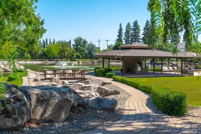 a view of a swimming pool with a patio
