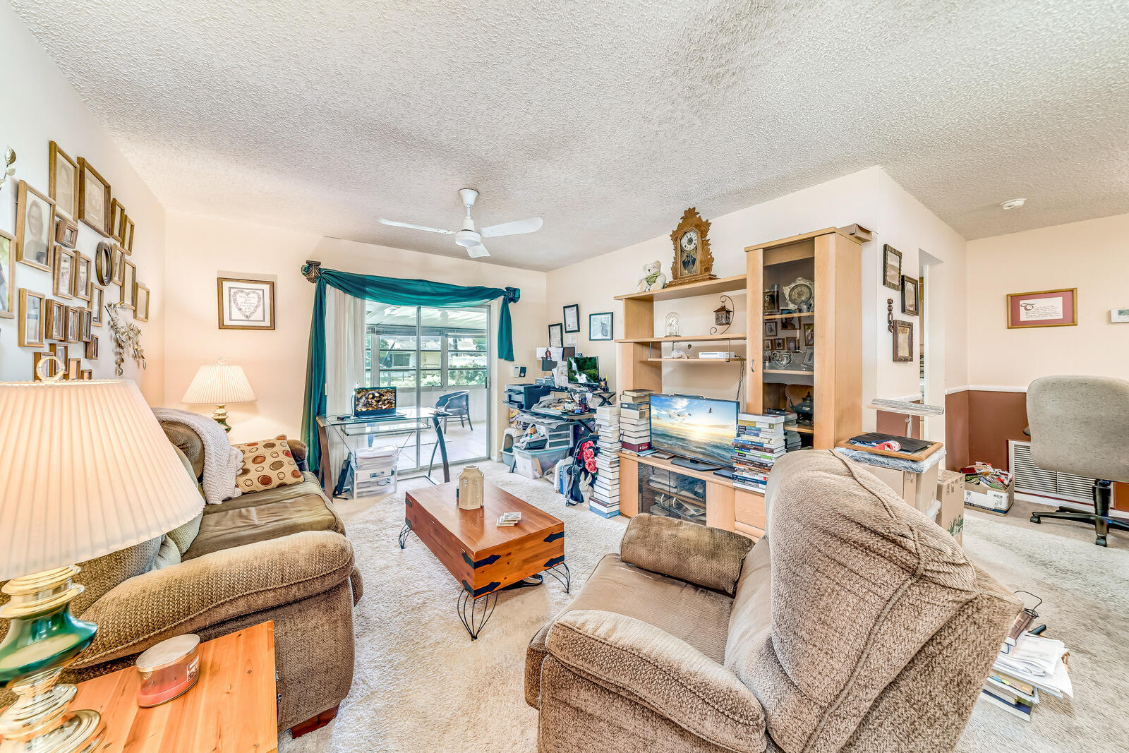 22243 Southwest 64th Way Boca Raton, FL 33428 - Photo 22 of 47 a living room with furniture and a large window