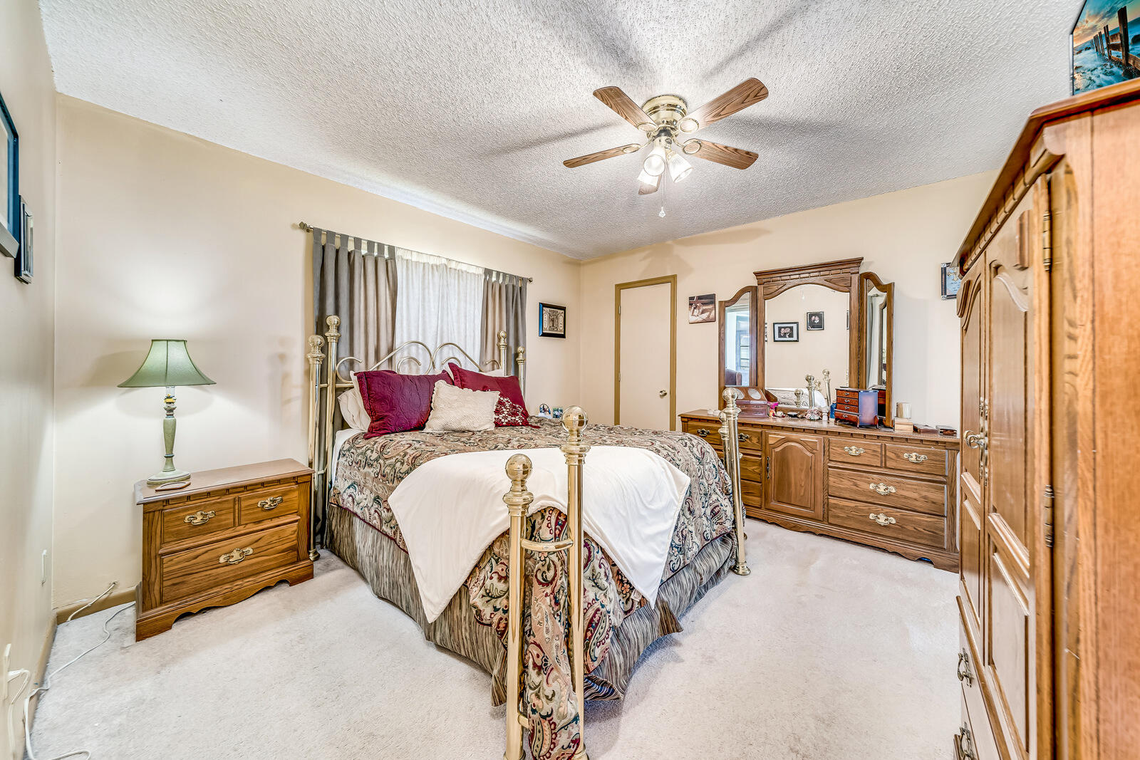 22243 Southwest 64th Way Boca Raton, FL 33428 - Photo 23 of 47 a bed room with a bed and a chandelier