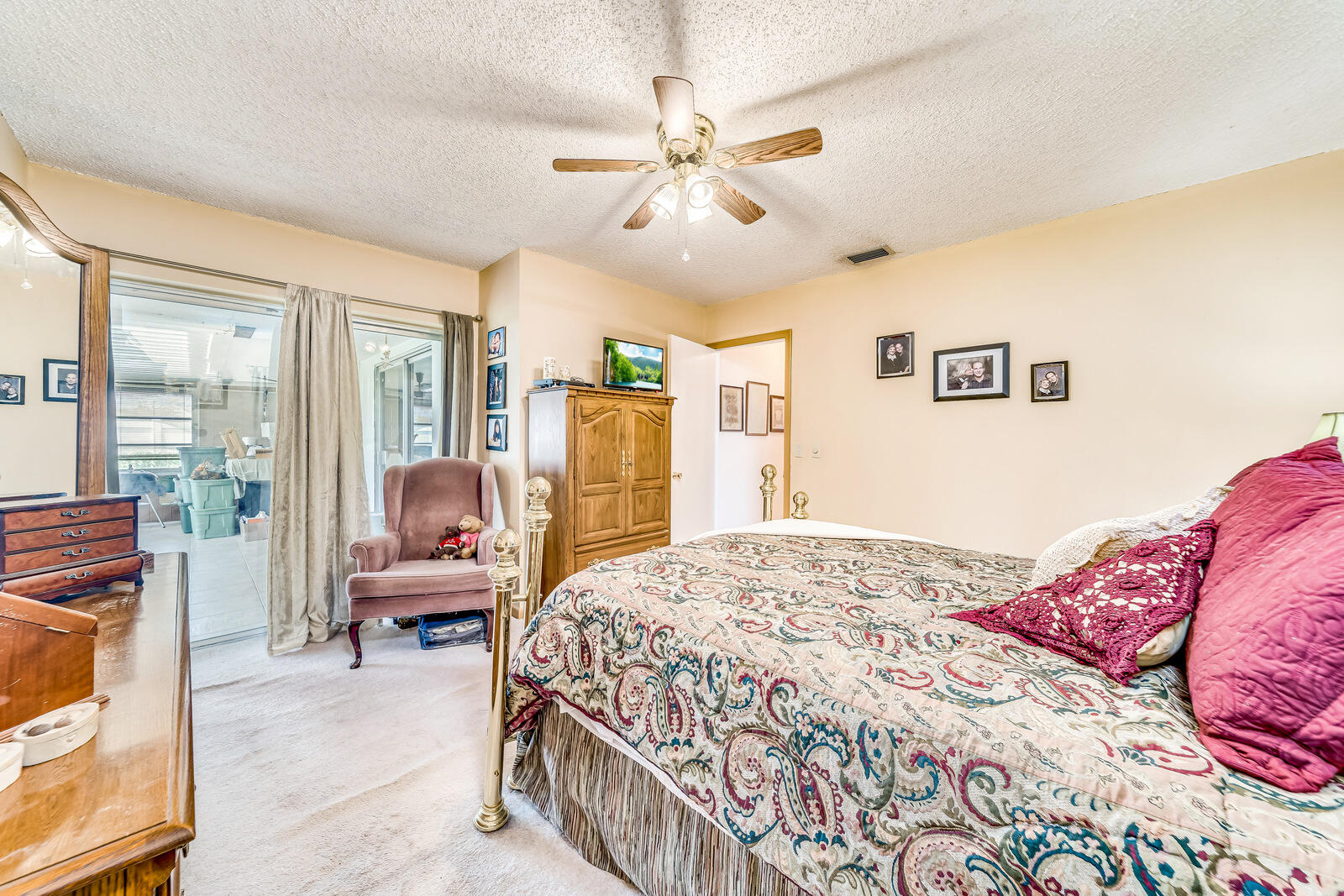 22243 Southwest 64th Way Boca Raton, FL 33428 - Photo 25 of 47 a bedroom with a bed couch and a window