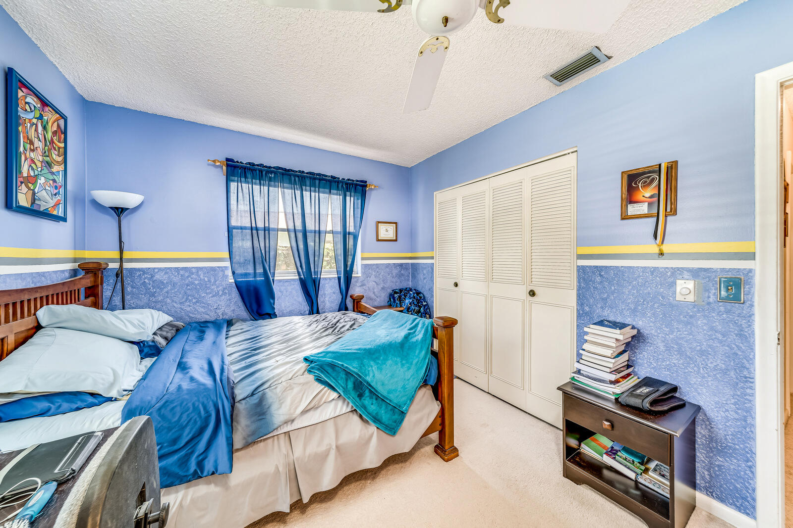 22243 Southwest 64th Way Boca Raton, FL 33428 - Photo 28 of 47 a bedroom with a bed and a dresser