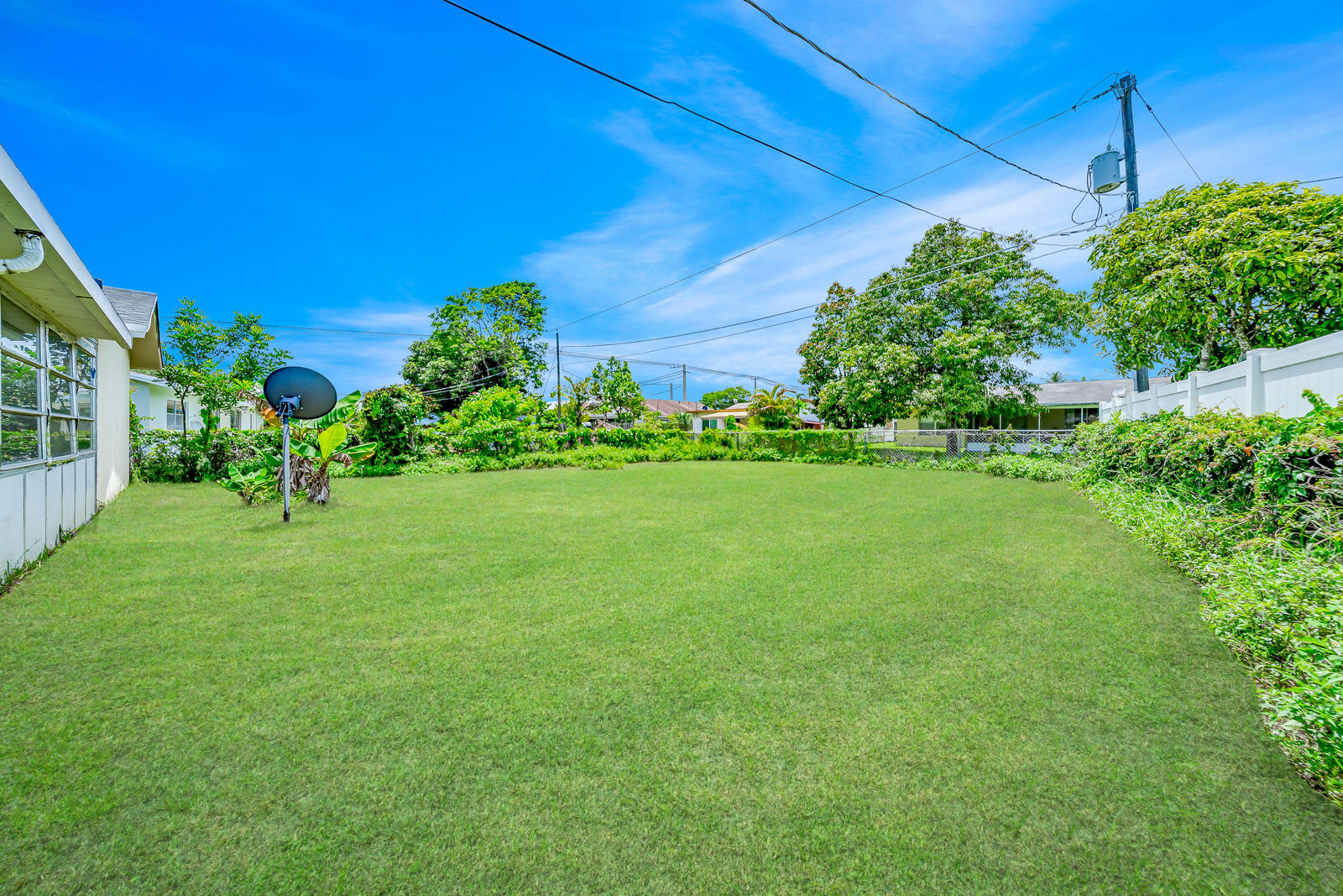 22243 Southwest 64th Way Boca Raton, FL 33428 - Photo 35 of 47 a backyard of a house with lots of green space