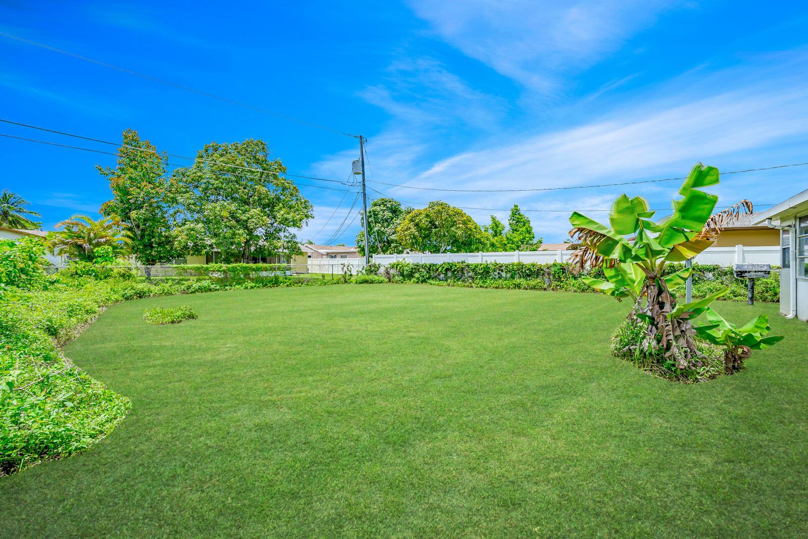 22243 Southwest 64th Way Boca Raton, FL 33428 - Photo 39 of 47 a view of a garden with a building in the background