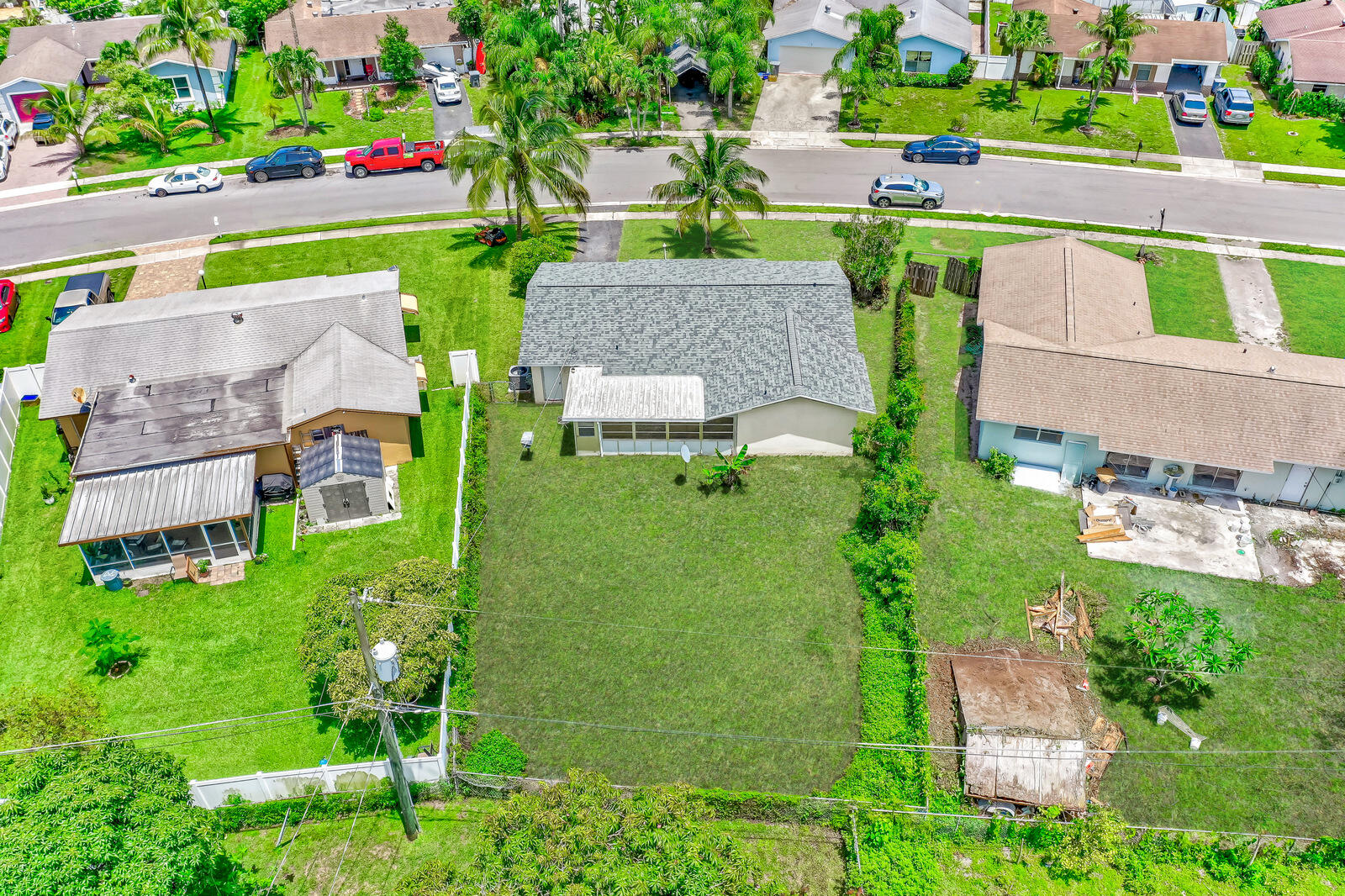 22243 Southwest 64th Way Boca Raton, FL 33428 - Photo 46 of 47 an aerial view of a house with a garden and lake view
