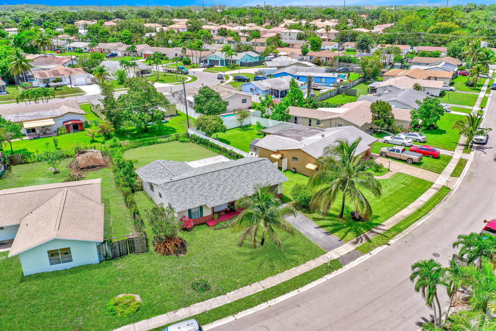 22243 Southwest 64th Way Boca Raton, FL 33428 - Photo 5 of 47 an aerial view of multiple houses with a yard