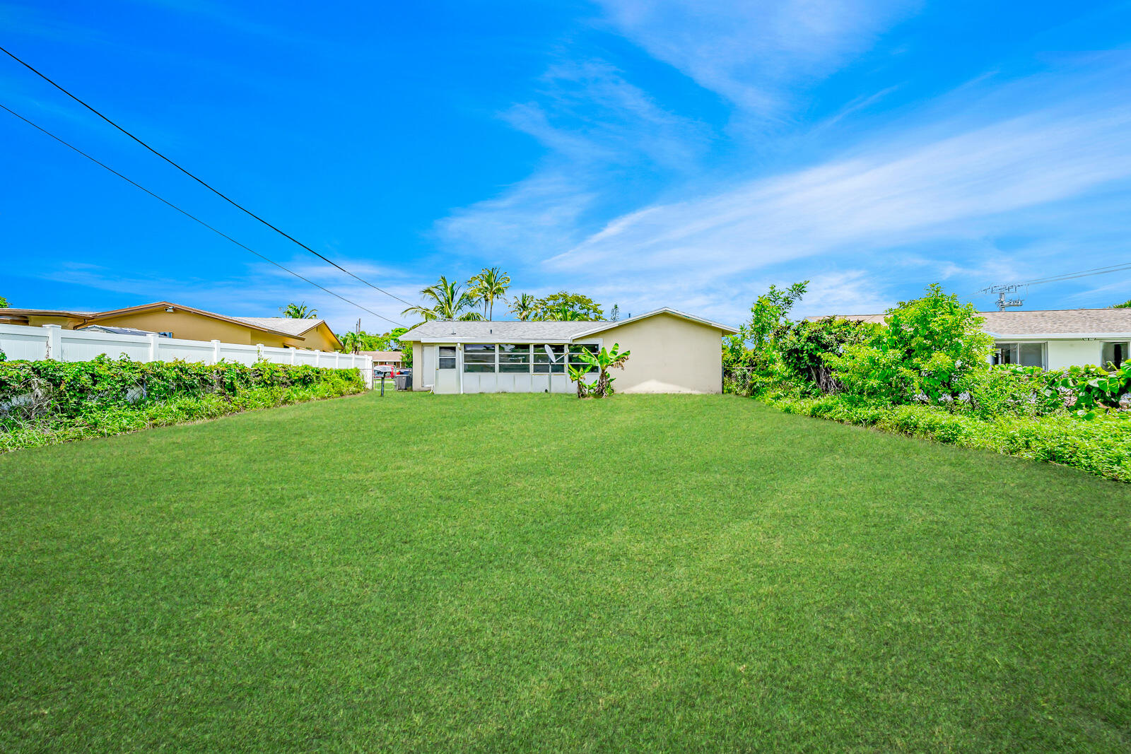 22243 Southwest 64th Way Boca Raton, FL 33428 - Photo 7 of 47 a view of a big yard with potted plants and large tree