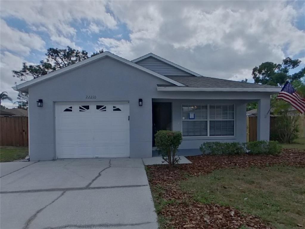 Undisclosed Address Land O' Lakes, FL 34639 - Photo 1 of 1 a view of a house with a yard