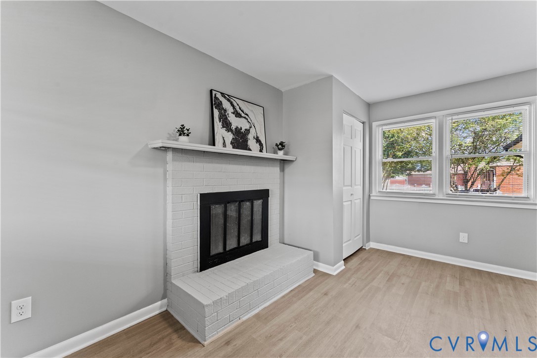 2000 Cleary Road Richmond, VA 23223 - Photo 17 of 28 Unfurnished living room featuring a fireplace and