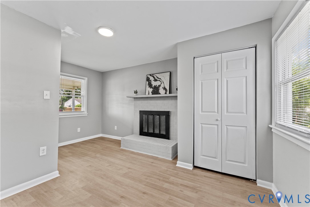 2000 Cleary Road Richmond, VA 23223 - Photo 19 of 28 Unfurnished living room featuring a brick fireplac