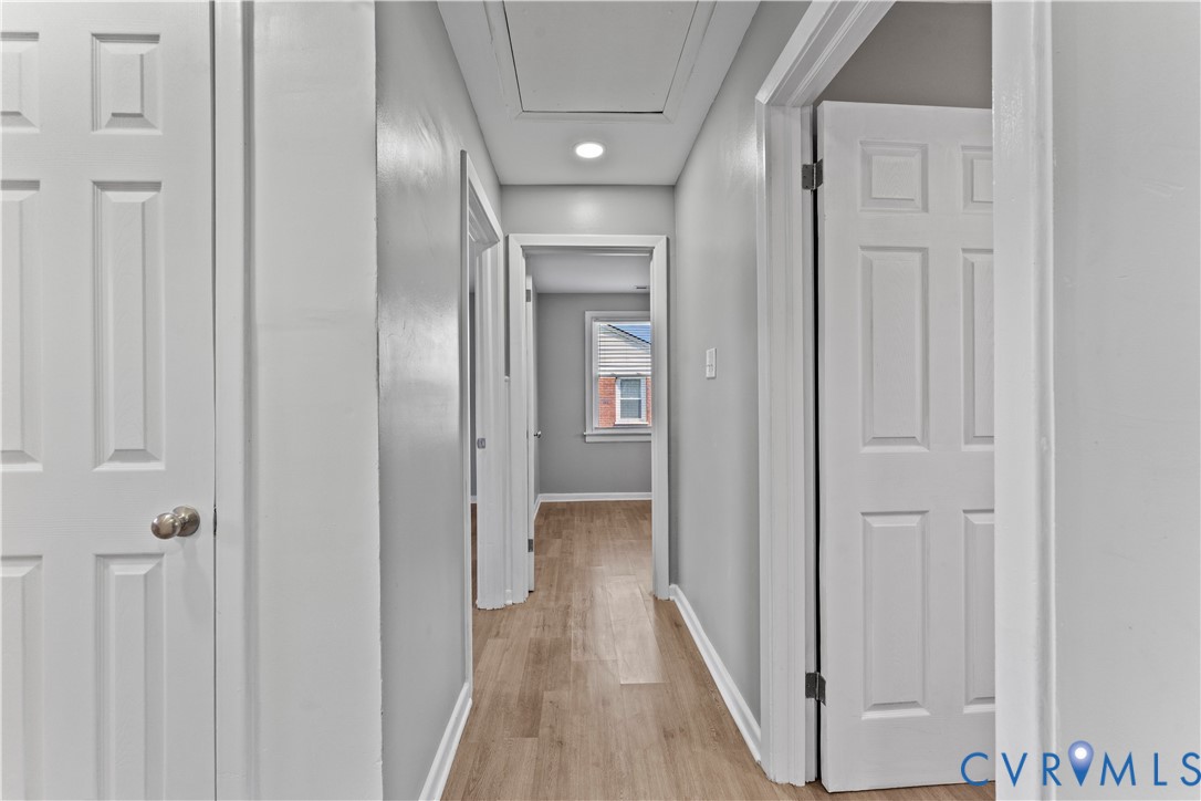 2000 Cleary Road Richmond, VA 23223 - Photo 22 of 28 Hallway with light wood finished floors and basebo