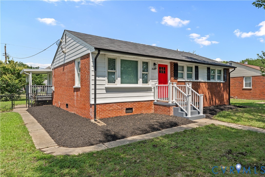 View of front facade featuring crawl space and bri