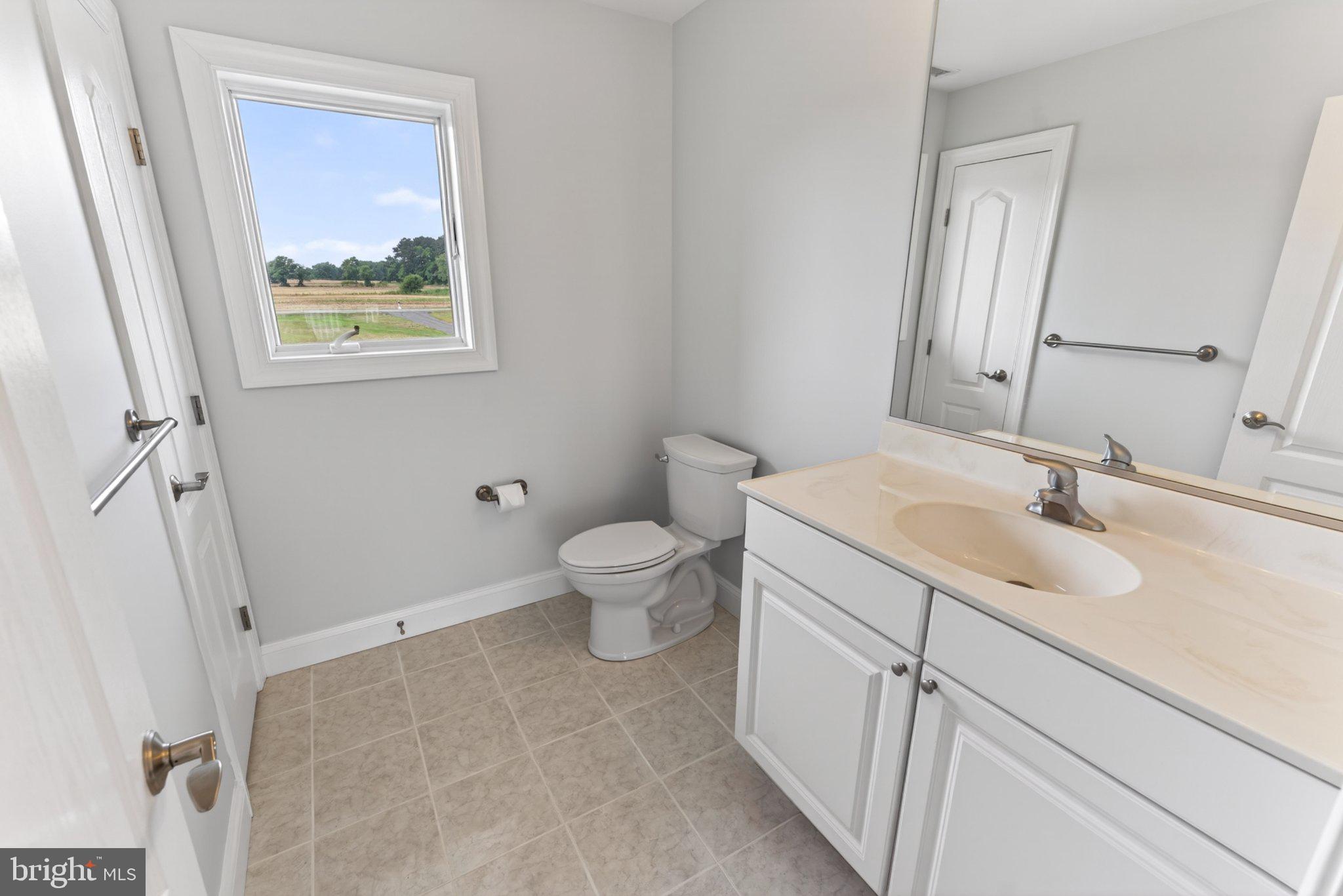 34029 Peppers Corner Road Millville, DE 19967 - Photo 49 of 101 Bright and airy bathroom retreat.
