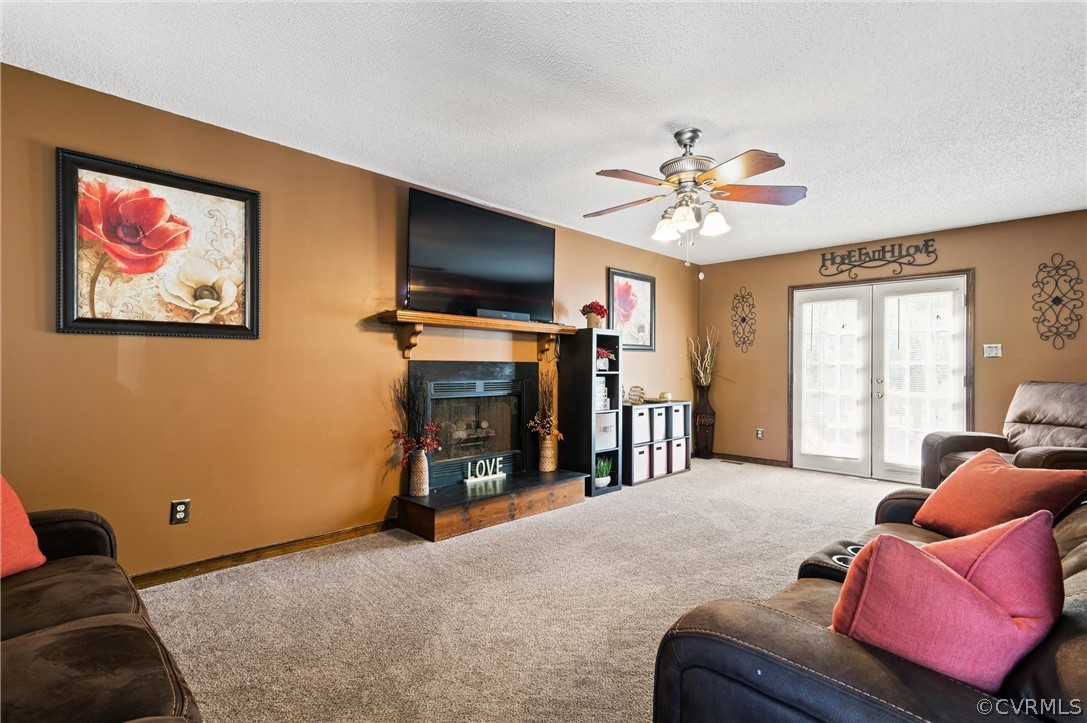 7329 Trailing Rock Road Prince George, VA 23875 - Photo 8 of 28 a living room with furniture and a fireplace
