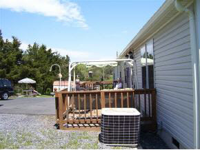 880 Union Church Road Churchville, VA 24421 - Photo 4 of 7 a view of a balcony with wooden floor and outdoor seating