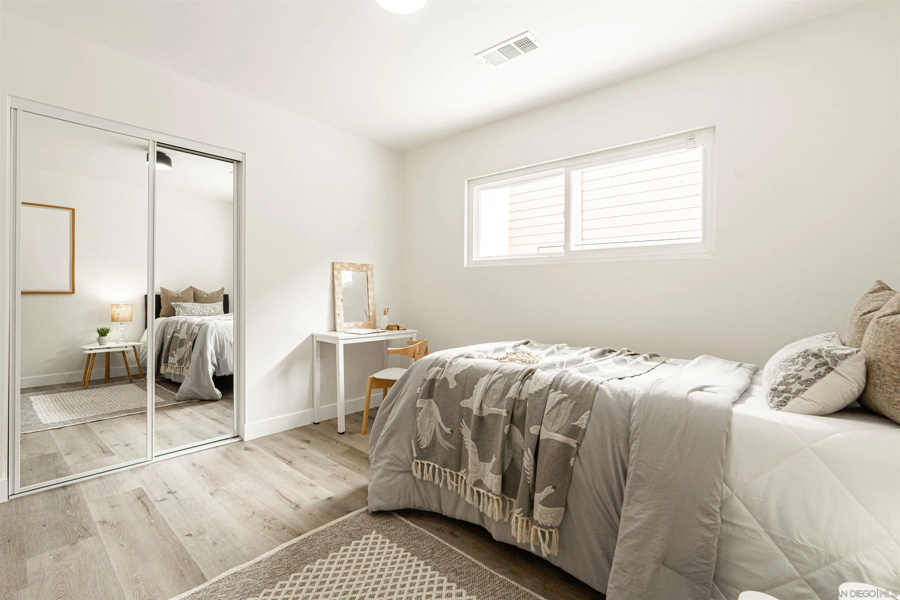 9376 Starcrest Drive Santee, CA 92071 - Photo 15 of 39 a bedroom with a bed and a window