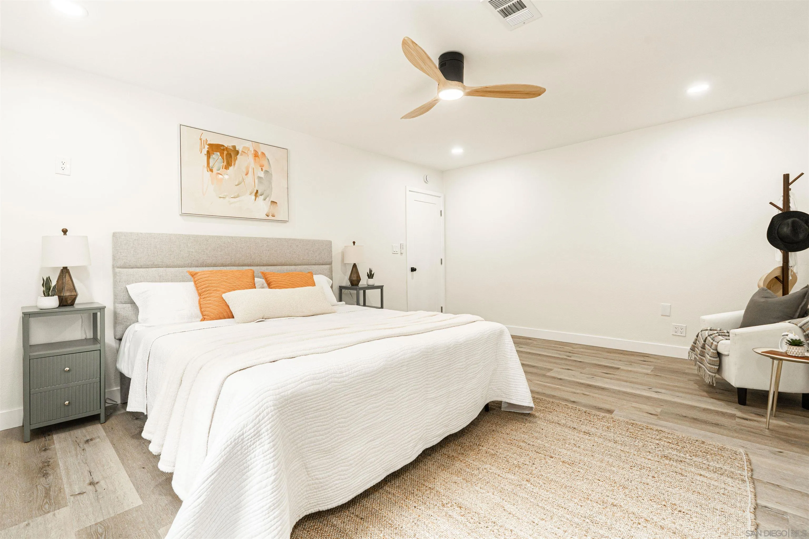 9376 Starcrest Drive Santee, CA 92071 - Photo 20 of 39 a bedroom with a bed and a painting on the wall