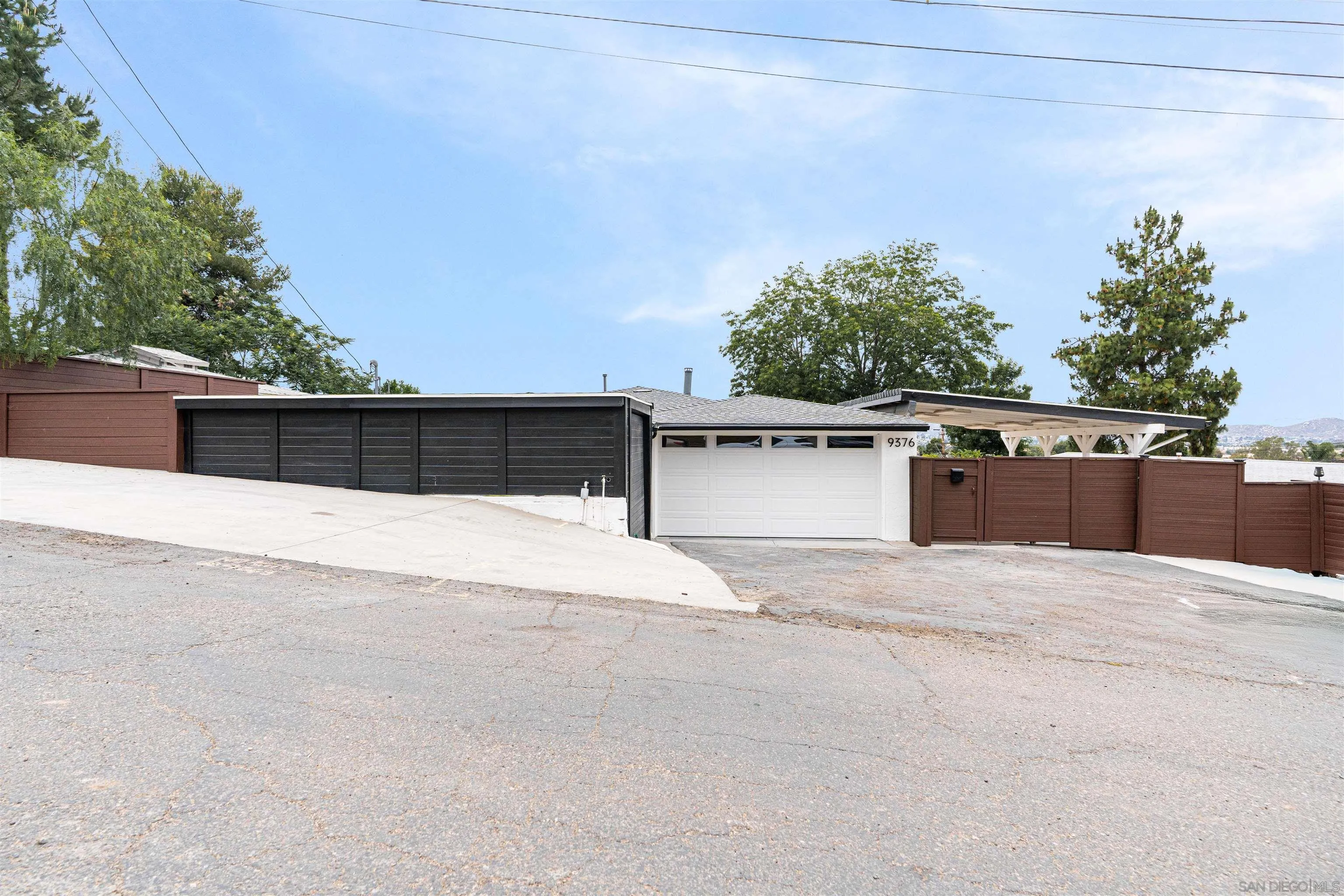9376 Starcrest Drive Santee, CA 92071 - Photo 33 of 39 a view of street with an outdoor seating