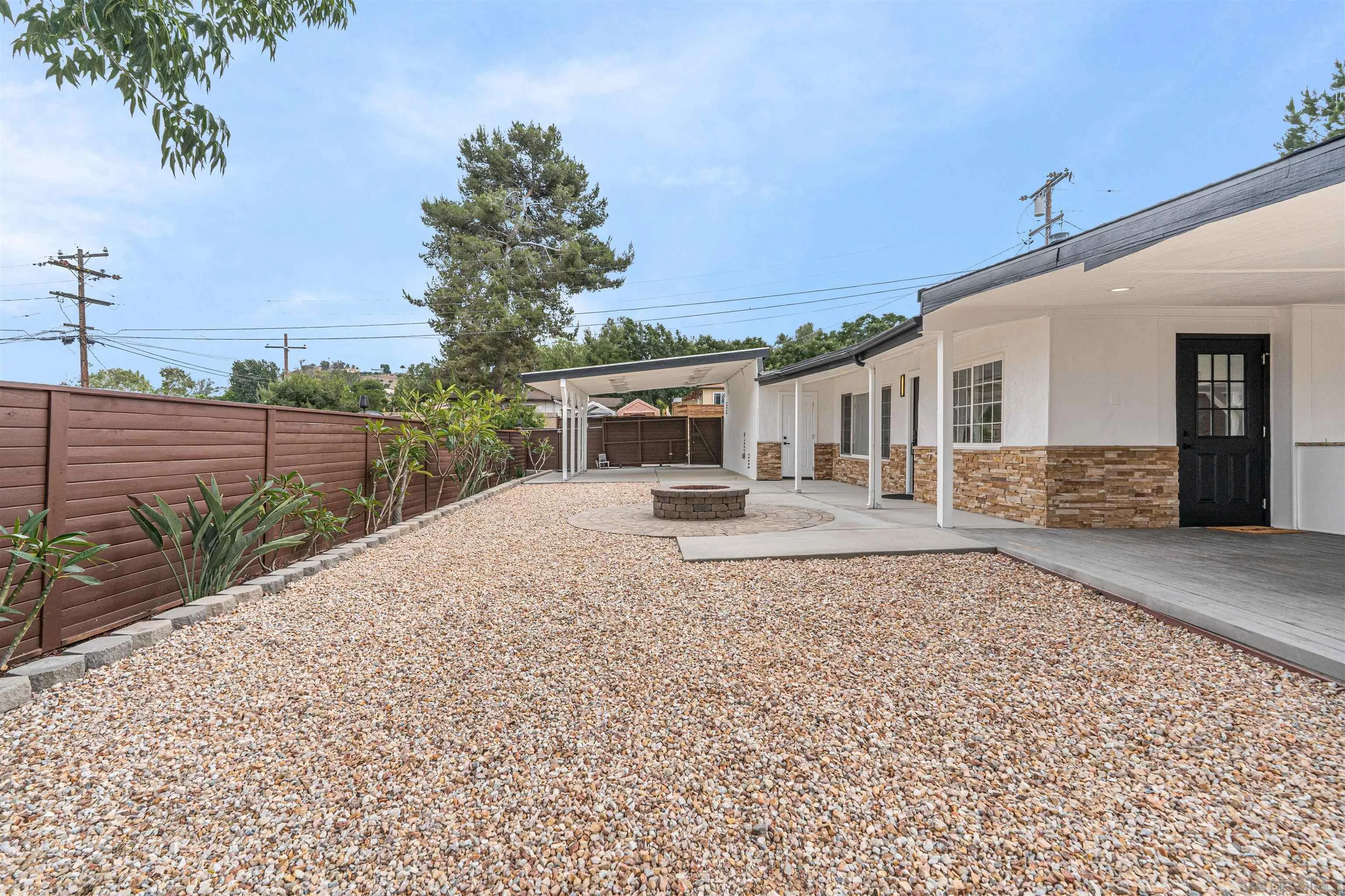 9376 Starcrest Drive Santee, CA 92071 - Photo 37 of 39 a front view of a house with a yard