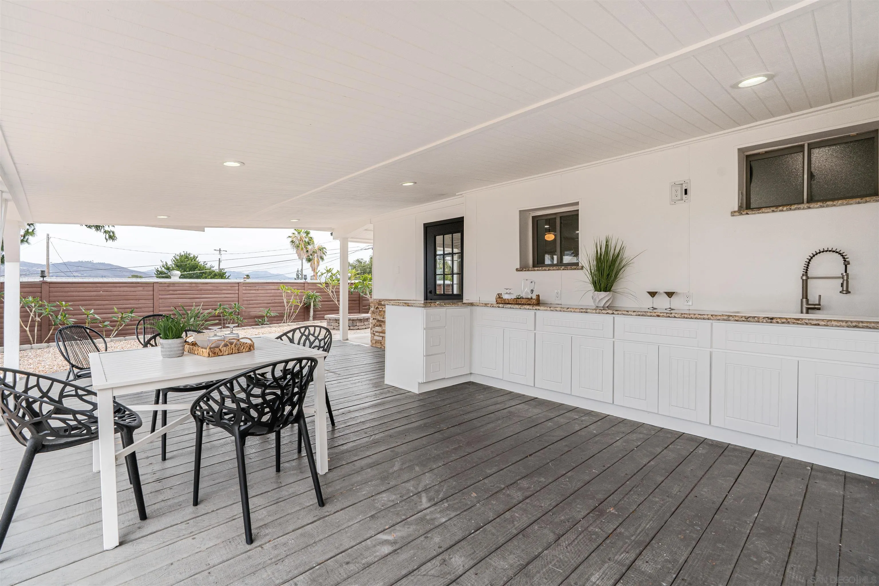 9376 Starcrest Drive Santee, CA 92071 - Photo 7 of 39 a view of a dining room with furniture and wooden floor
