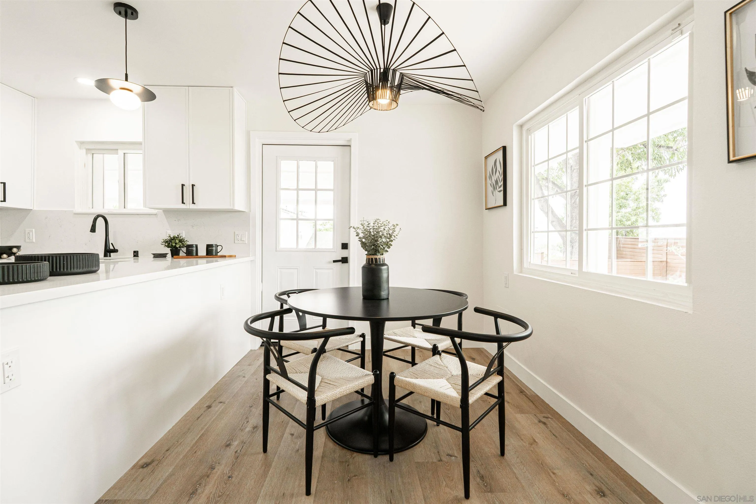 9376 Starcrest Drive Santee, CA 92071 - Photo 9 of 39 a view of a dining room with furniture and a chandelier