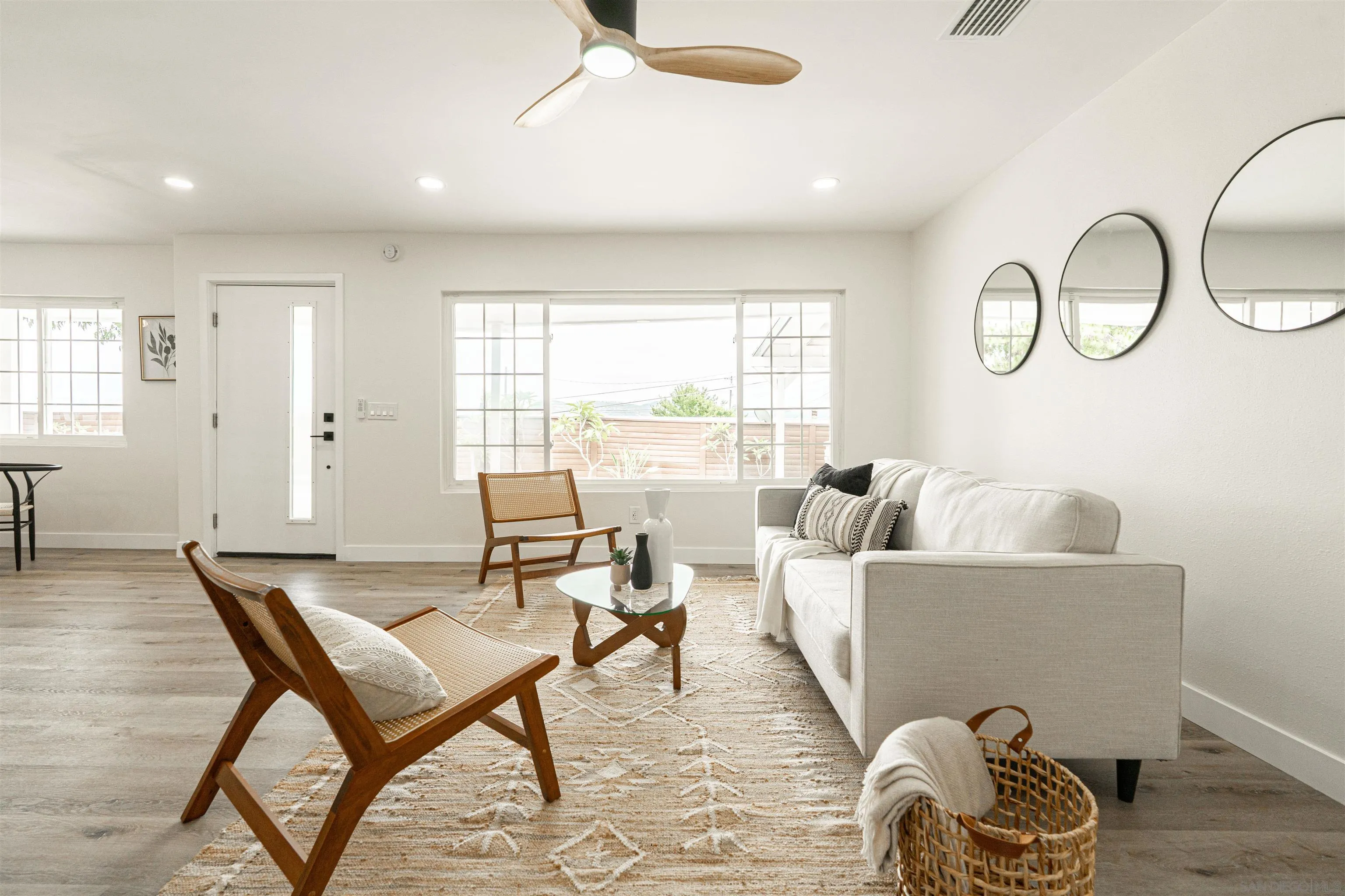 9376 Starcrest Drive Santee, CA 92071 - Photo 10 of 39 a living room with furniture a table and a large window