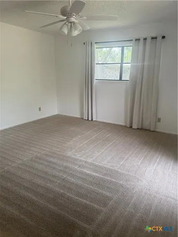 a kitchen with stainless steel appliances kitchen island granite countertop a sink and cabinets