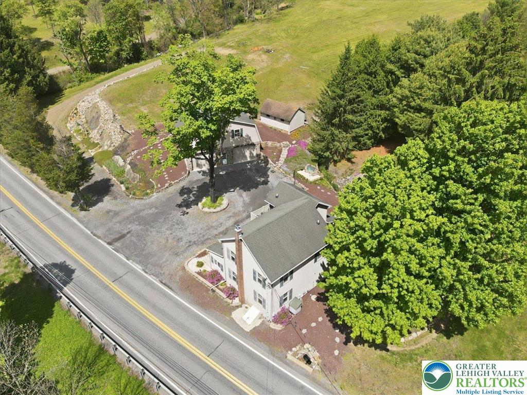4880 Little Gap Road Kunkletown, PA 18058 - Photo 88 of 100 This verdant aerial view reveals a charming residence nestled amidst a landscape of lush trees.