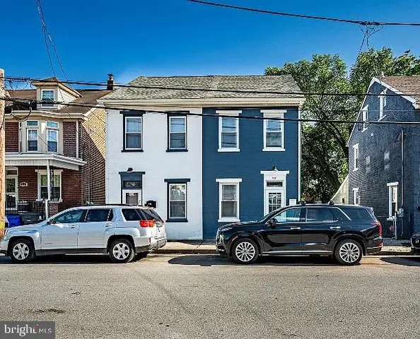a view of a car parked in front of a building