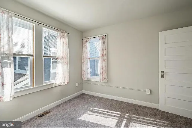 a view of an empty room and window