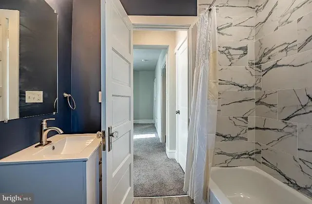 a bathroom with a sink and a tub
