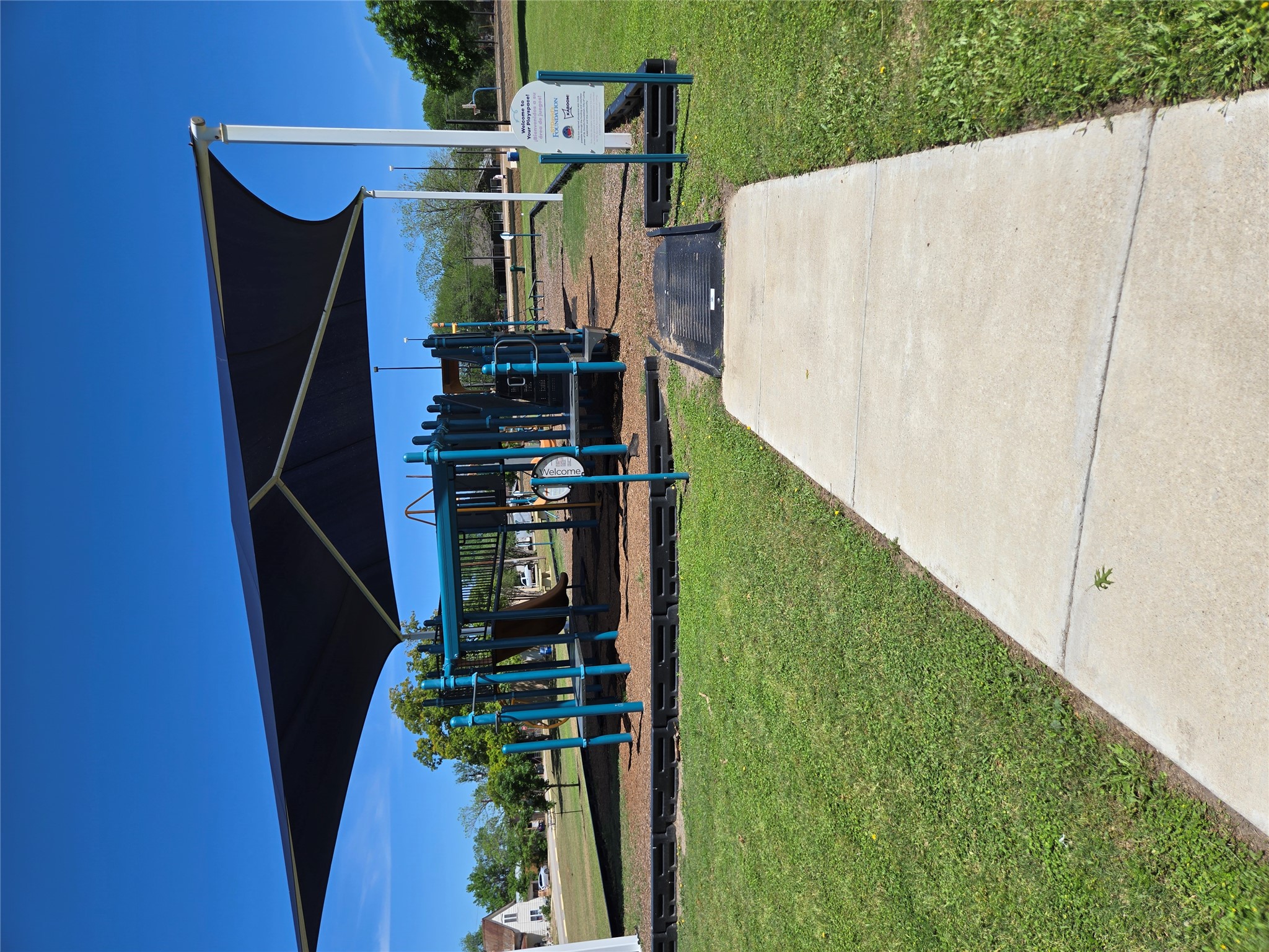 174 Falcon Drive Luling, TX 78648 - Photo 32 of 37 a view of a patio with a table and chairs under an umbrella