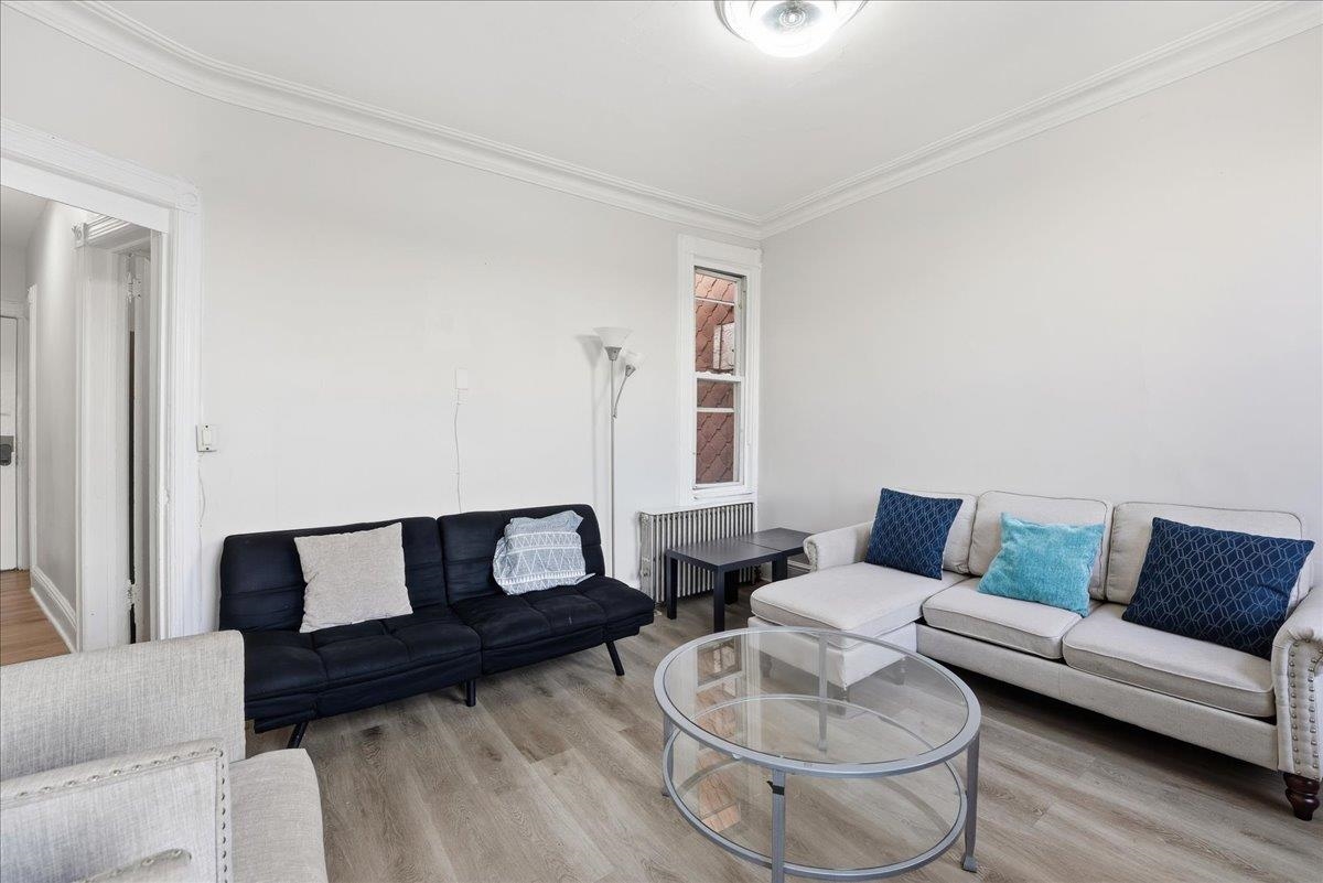 335 47th Street, Unit 3 Union City, NJ 07087 - Photo 2 of 14 a living room with furniture and a couch