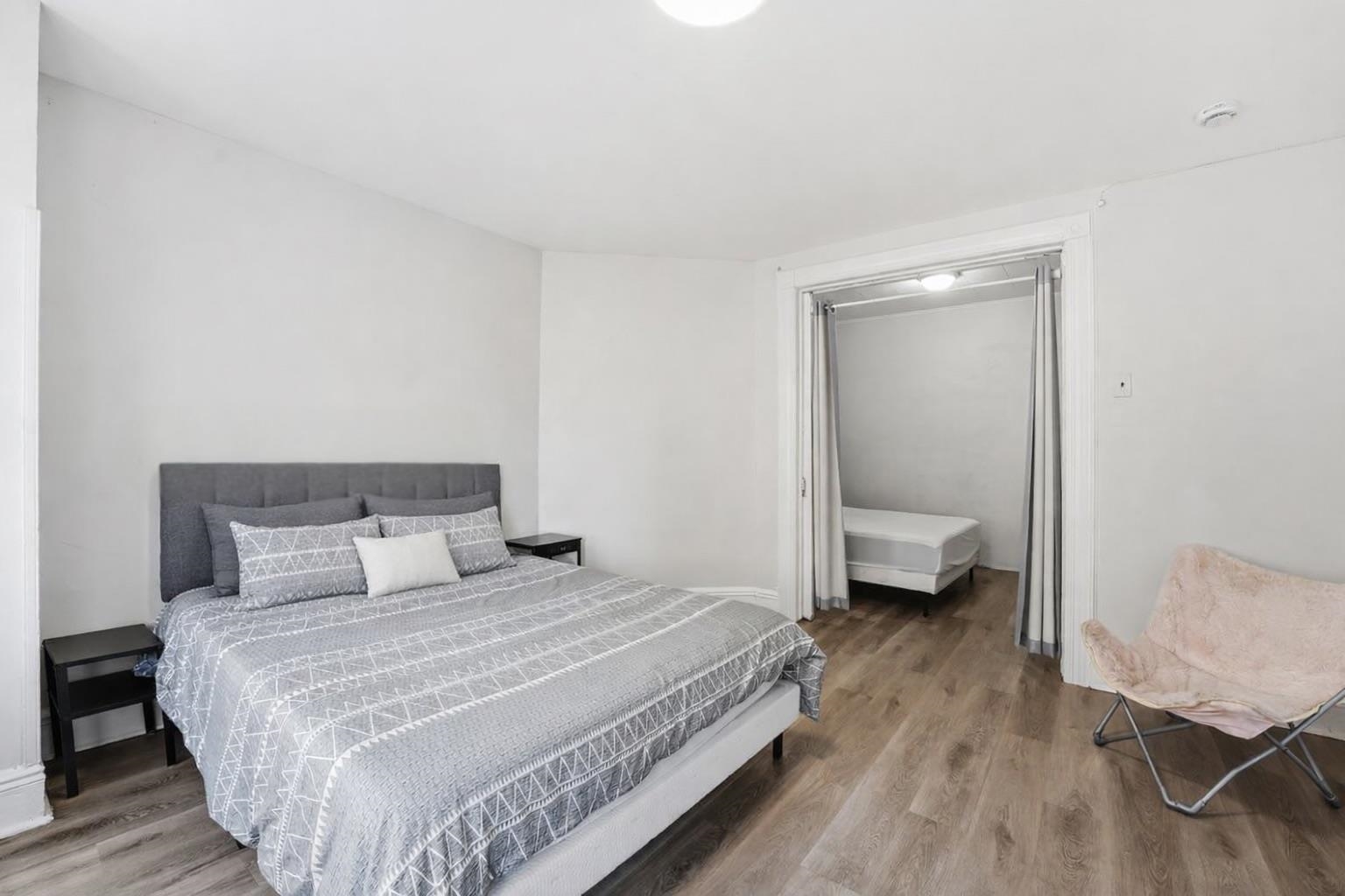 335 47th Street, Unit 3 Union City, NJ 07087 - Photo 9 of 14 a bedroom with a bed and wooden floor