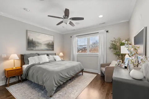 a bedroom with a bed couch and window