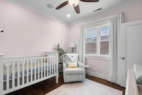 a bedroom with furniture and windows