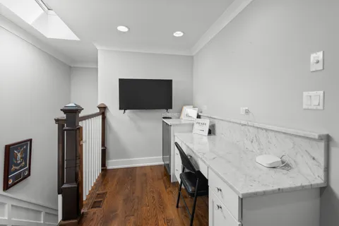 a kitchen with a sink appliances and a counter top space