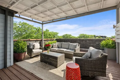 a outdoor living space with furniture and city view