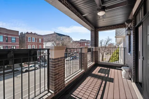 a view of a balcony with wooden floor