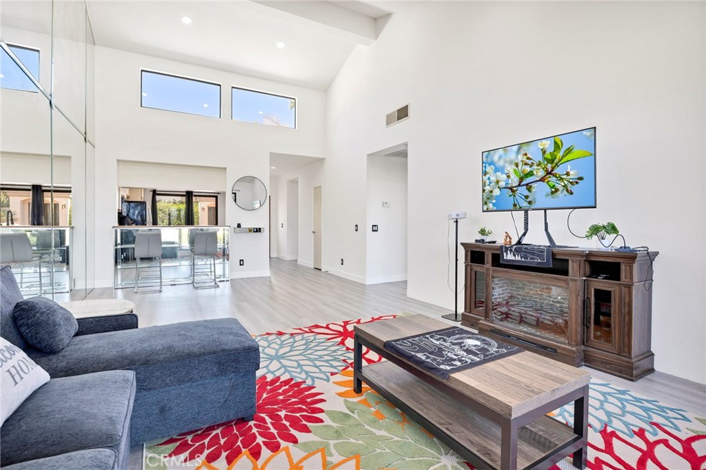 54880 Inverness Way La Quinta, CA 92253 - Photo 12 of 35 a living room with furniture and a wooden floor