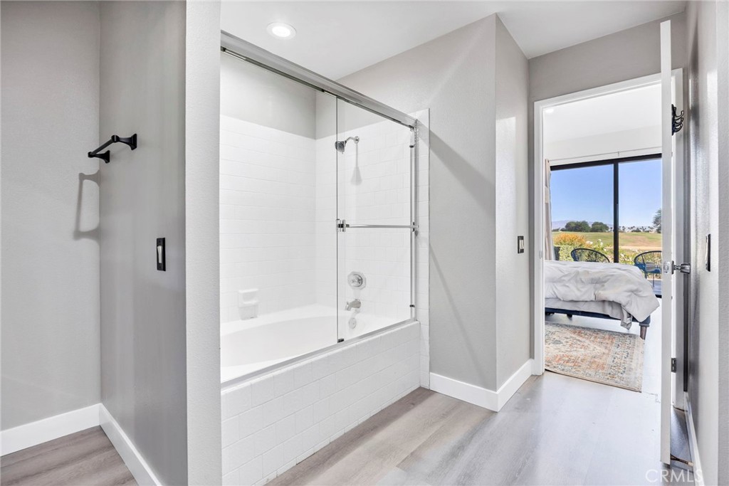 54880 Inverness Way La Quinta, CA 92253 - Photo 21 of 35 a bathroom with a tub and shower