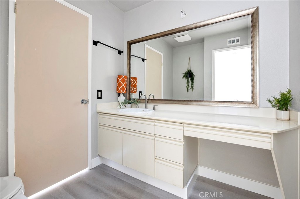 54880 Inverness Way La Quinta, CA 92253 - Photo 25 of 35 a bathroom with a sink and a mirror